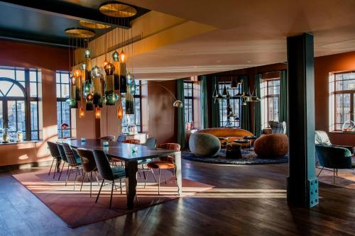 a dining room with a table and chairs at Motel One Edinburgh-Princes in Edinburgh