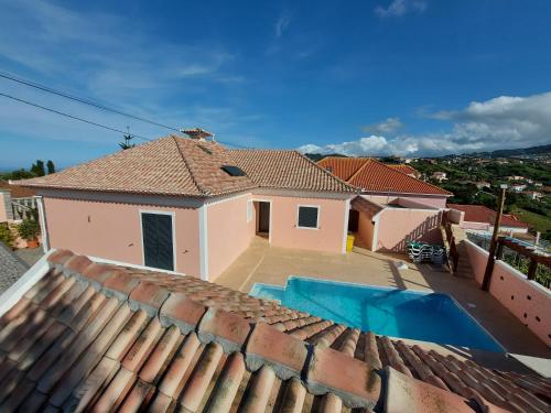a view from the roof of a house with a swimming pool at Quintinha do Álvaro - Holiday house in Santana
