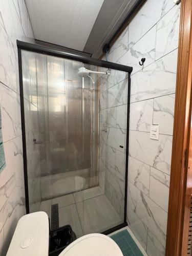 a shower in a bathroom with a toilet at Vila do Chaves Casa Seu Madruga 72 in Itajaí