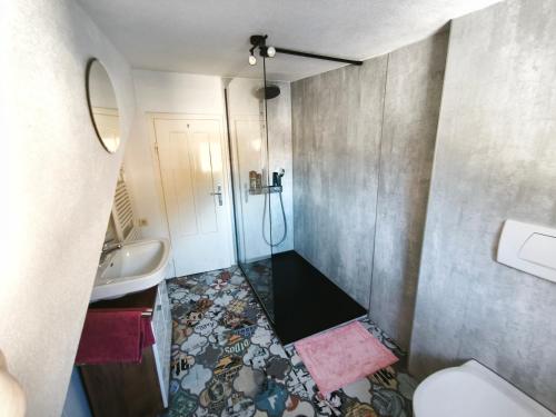 a small bathroom with a sink and a toilet at sonnberg in Ischgl