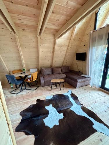 a living room with a couch and a table at Vila Mia in Žabljak