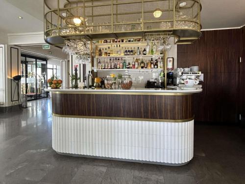 a bar in a restaurant with a counter at Hotel Plaza Biarritz Plage - Handwritten Collection in Biarritz