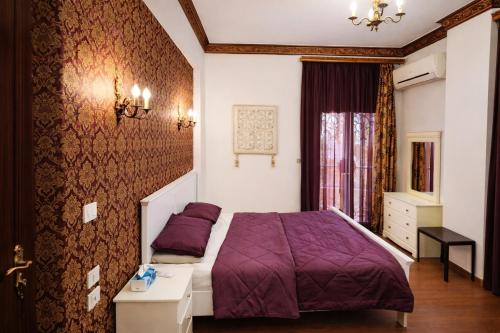 a bedroom with a purple bed and a window at The New Cairo 3BR Residence in Cairo
