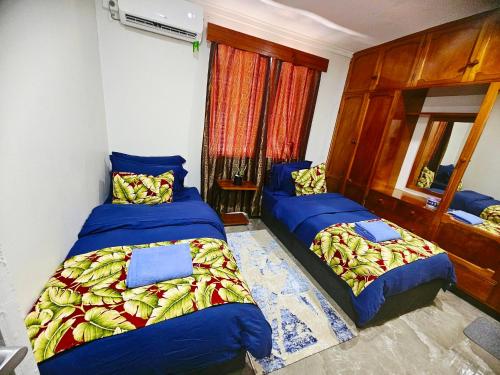 Llit o llits en una habitació de Tabusuka Accommodation