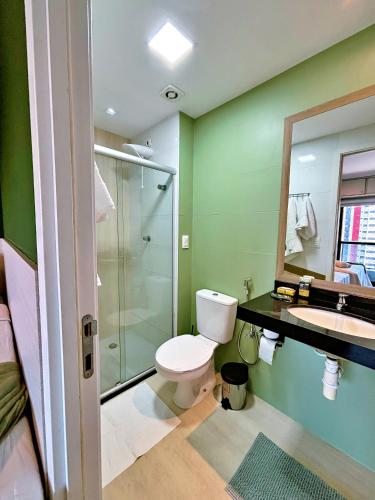 a bathroom with a toilet and a shower and a sink at Vacanze - Time in Maceió