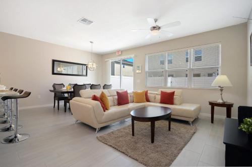 a living room with a couch and a table at Four Bedrooms TownHome 5130 in Kissimmee