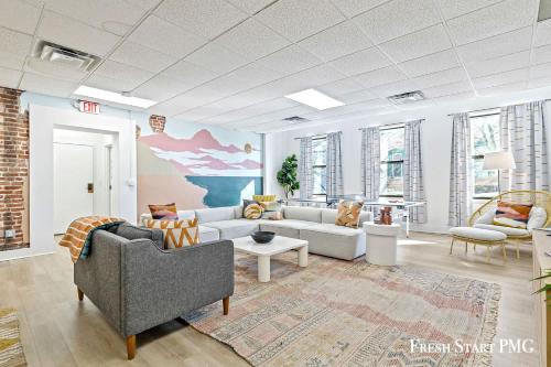 a large living room with couches and a rug at City View Loft in Saint Joseph
