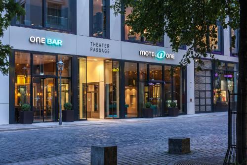 a store front of a building on a street at Motel One Leipzig-Augustusplatz in Leipzig