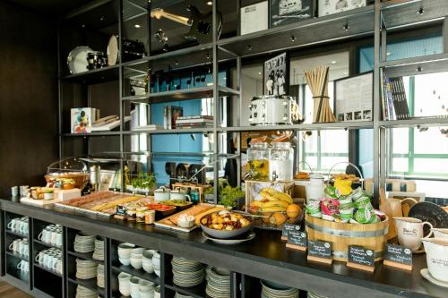 a buffet line with a lot of food on display at Motel One Mannheim in Mannheim