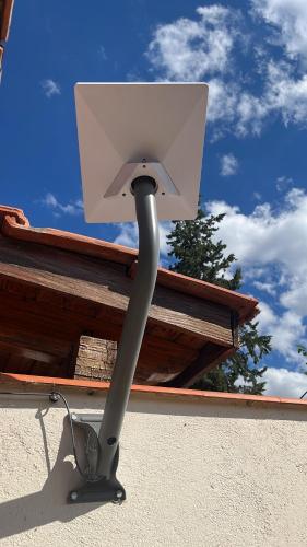 a security camera on the side of a building at NicoMay in Ciudad Lujan de Cuyo
