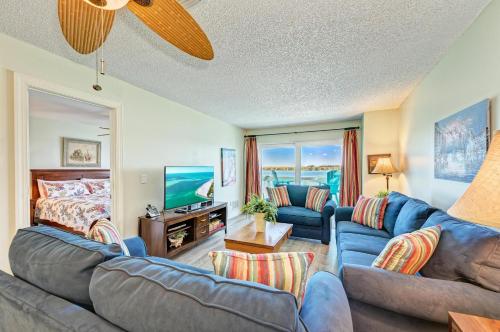 a living room with a couch and a bed at Anna Maria Island Beach Palms 5B in Bradenton Beach