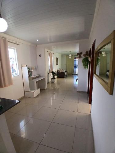 a large living room with a large tile floor at Brisa Tropical in Ilhéus