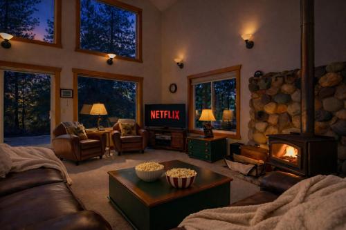a living room with a couch and a fireplace at Pine Tree Cottage by NW Comfy Cabins in Leavenworth