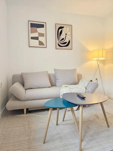 a living room with a couch and a table at Elroi Suite in Minden