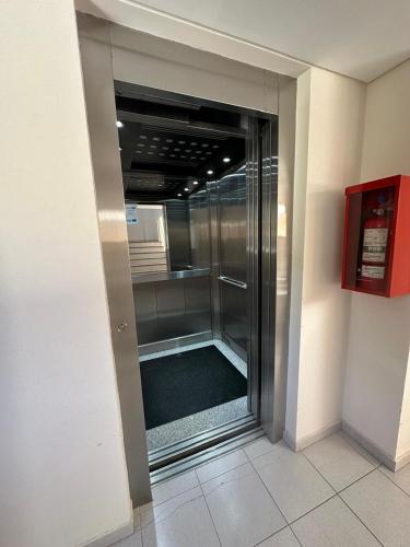 a glass walk in shower in a building at Depto centrico soñado in San Martín de los Andes