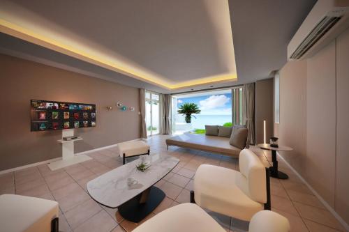 a living room with a view of the ocean at Crystal Villa Miyakojima Sunayama Beach in Miyako-jima