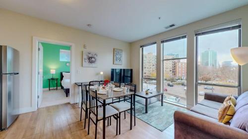 a living room with a table and a couch at Stylish Home With Free ParkingFA in Stamford