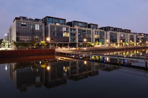 a group of buildings next to a body of water at Eastlake Retreat Kingston in Kingston 