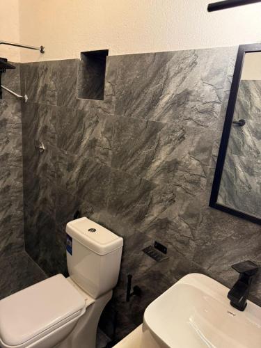 a bathroom with a toilet and a sink at Mount Boutique Villa in Kandy