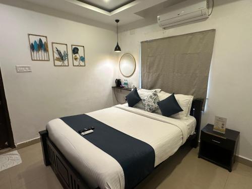 a bedroom with a large bed in a room at BRICK CASTLE in Chennai