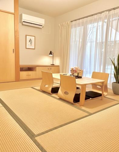 a dining room with a table and chairs at Sunshine in Tokyo