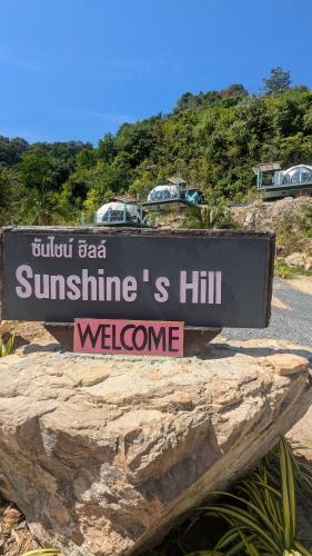a sign that reads sunithsiths hill welcome at Sunshine's Hill in Ko Lanta