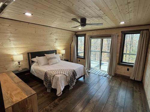 a bedroom with a bed and a ceiling fan at Eagles Rest in Murray