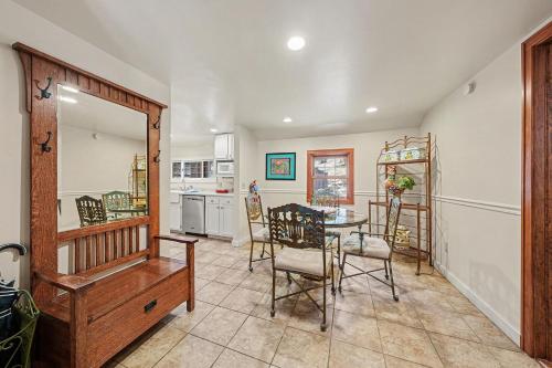 a kitchen and dining room with a table and chairs at Twin Fawns - EV #3417 in Estes Park
