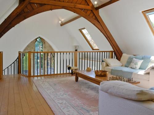 a living room with a couch and a table at St John The Baptist in Capel Curig