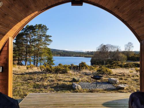 a view of a lake through an arched window at Now - Uk50567 in Port of Menteith