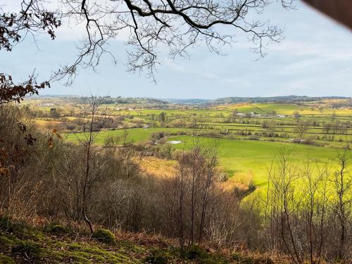 a view of a green field from a hill at Y Smithy - Uk49022 in Llanybyther