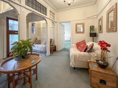 a living room with a couch and a table at Seawinds - Uk50857 in Colwyn Bay