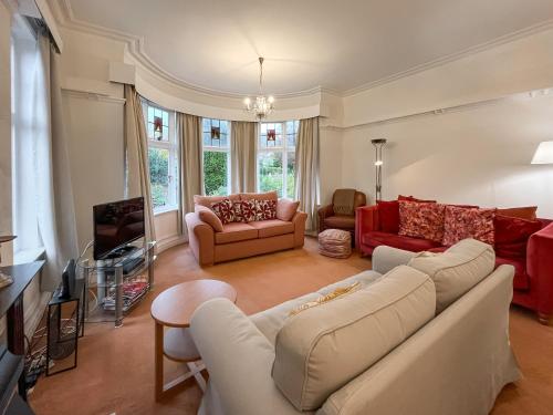a living room with two couches and a tv at Seawinds - Uk50857 in Colwyn Bay