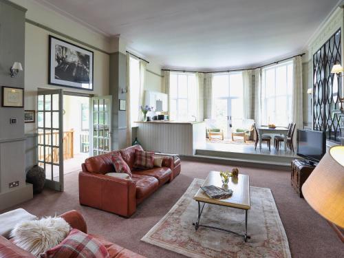 a living room with a couch and a table at Stargazers - Uk3445 in Greenhaugh