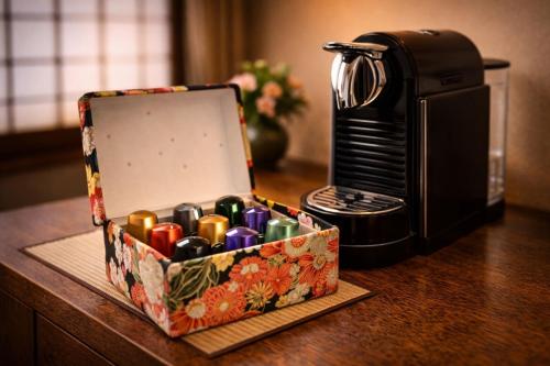 a box ofighters sitting on a table next to a microwave at AKARI Kyoto Gion in Kyoto