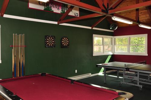 a billiard room with a pool table in it at Tranquil Timbers Park Model 7 in Sturgeon Bay