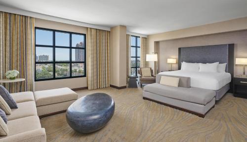 a hotel room with a bed and a couch at Hyatt Regency La Jolla at Aventine in San Diego