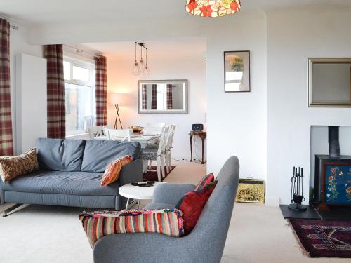 a living room with a couch and a table at Craignair in Port William