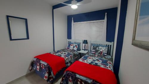 a bedroom with two twin beds and a window at Nomads Nook 3 in Ramsgate