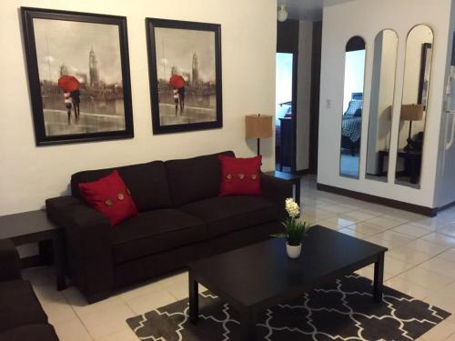 a living room with a couch and a coffee table at Beautiful 2 bedroom 1 bath in Tamuning