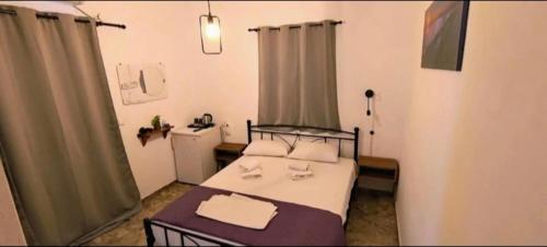 En eller flere senge i et værelse på Pension Panagiota