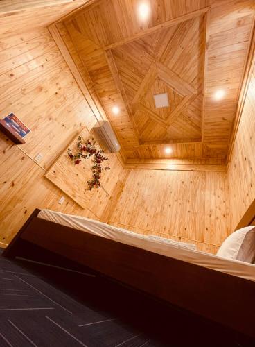 an overhead view of a room with a wooden ceiling at Homestay CÂY THỊ in Tây Ninh