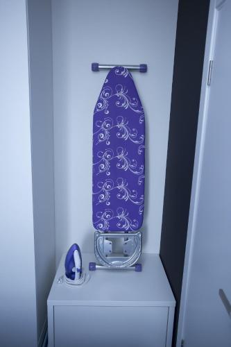 a suitcase sitting on top of a dresser at Aparthotel Tangerine in Batumi