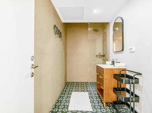 a bathroom with a sink and a mirror at Redsearent suite with pool view 2 in Eilat