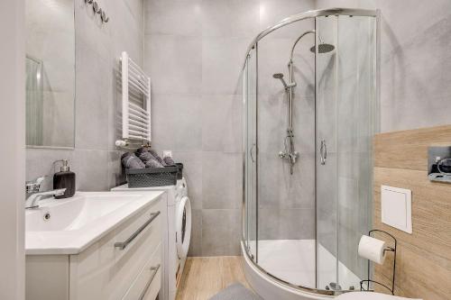 a bathroom with a shower and a sink at Central Platinum Apartments 29 in Rybnik