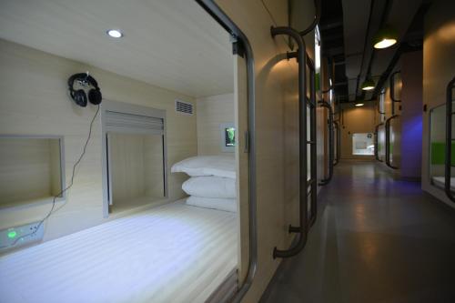 Postel nebo postele na pokoji v ubytování 深圳栖游青年旅馆Shenzhen Xi You Hostel