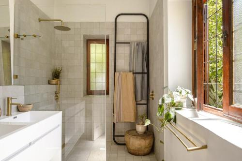 a bathroom with a shower and a sink at Am Flus- at the river in Stellenbosch