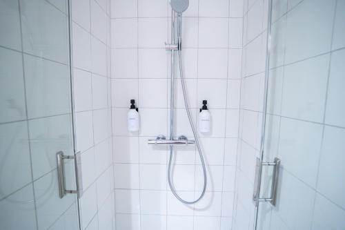 a shower with a shower head in a bathroom at Charming Elegant Suite - Downtown - AF in Carcassonne