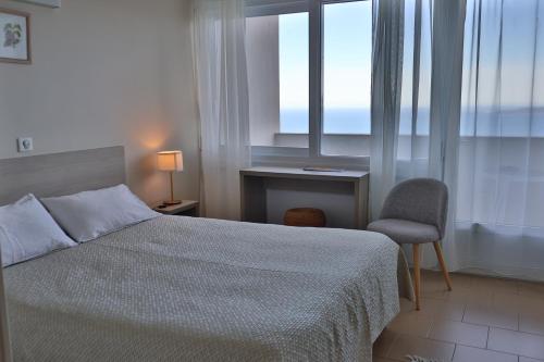 Llit o llits en una habitació de le Belvedere