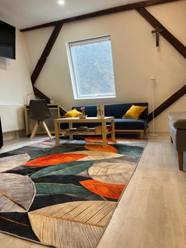 a living room with a table and a couch at Riverside-Appartements in Boppard